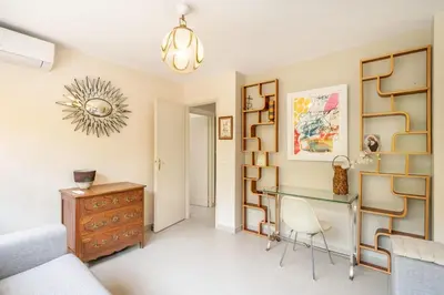 a living room with a desk and a chair at Pleasant 2 bedroom with large terrace in Cannes