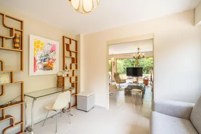 a living room with a couch and a table at Pleasant 2 bedroom with large terrace in Cannes
