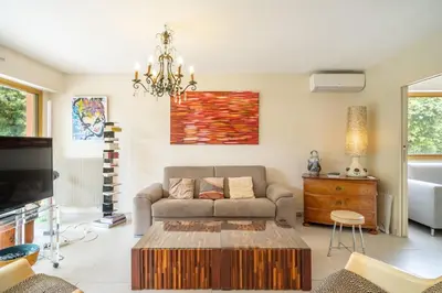 a living room with a couch and a coffee table at Pleasant 2 bedroom with large terrace in Cannes