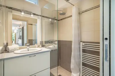 a bathroom with a sink and a shower at Pleasant 2 bedroom with large terrace in Cannes