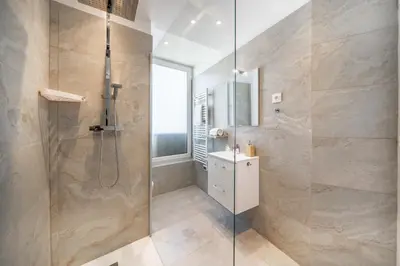 a bathroom with a shower with a glass door at Superb two-bedroom near the Croisette in Cannes