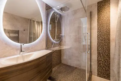 a bathroom with a tub and a sink and a mirror at Cozystay 1243 Port & Sea View Cannes in Cannes