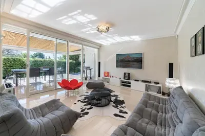 a living room with a couch and a table at Brand new 3 bedrooms heart of Cannes in Cannes