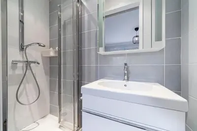 a white bathroom with a sink and a shower at Brand new 3 bedrooms heart of Cannes in Cannes