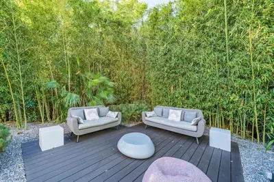 two couches and a table on a wooden deck at Brand new 3 bedrooms heart of Cannes in Cannes