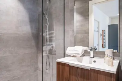 a bathroom with a sink and a shower at Pleasant 2 bedroom in the heart of Cannes in Cannes