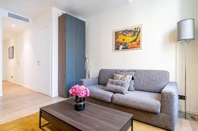 a living room with a couch and a coffee table at Pleasant 2 bedroom in the heart of Cannes in Cannes