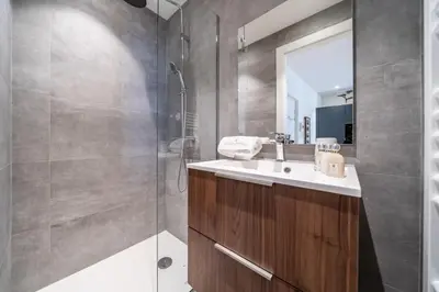a bathroom with a sink and a shower at Pleasant 2 bedroom in the heart of Cannes in Cannes