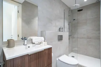 a bathroom with a sink and a toilet and a shower at Pleasant 2 bedroom in the heart of Cannes in Cannes