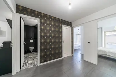 an empty room with a bedroom and a bathroom at COZYSTAY - Brand new 3 bedrooms 2min walk to carlton hotel in Cannes