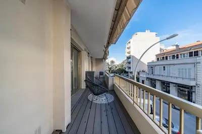a balcony of a building with a bench on it at COZYSTAY - Brand new 3 bedrooms 2min walk to carlton hotel in Cannes