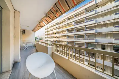 a room with a white table and a building at Apartment for 4 people in the heart of Cannes in Cannes