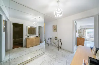 a living room with a television and a table at Apartment for 4 people in the heart of Cannes in Cannes