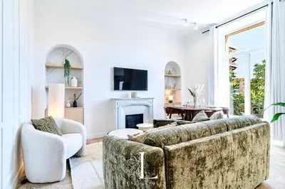 a living room with two couches and a fireplace at Les Lucioles 7- Luxury 2 - Bedroom Apartment in Cannes