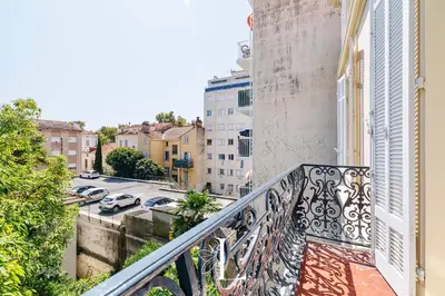 a balcony with a view of a parking lot at Les Lucioles 7- Luxury 2 - Bedroom Apartment in Cannes