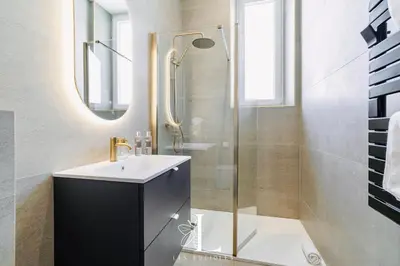 a bathroom with a sink and a shower at Les Lucioles 7- Luxury 2 - Bedroom Apartment in Cannes