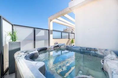 a swimming pool in the middle of a building at 3-Br Rooftop with Jacuzzi & Parking Cannes in Cannes
