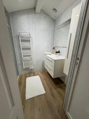 a small bathroom with a sink and a mirror at Le Loft Cannes in Cannes