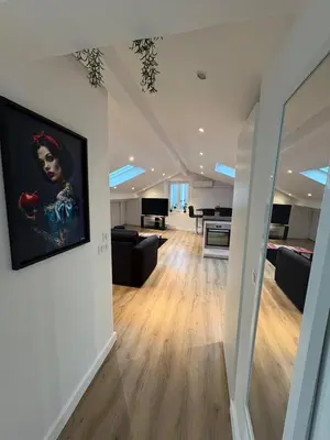 a living room with a painting on the wall at Le Loft Cannes in Cannes