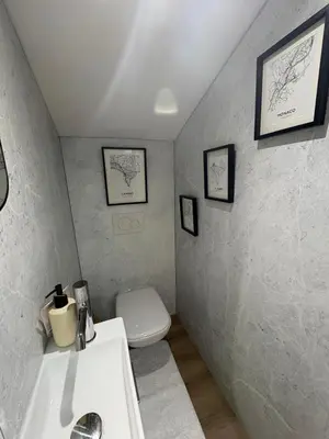 a bathroom with a white sink and a toilet at Le Loft Cannes in Cannes