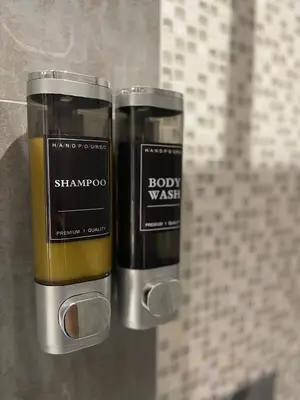 a couple of bottles of soap on a wall at Apparemment cosy avec balcon plein centre de Cannes - Carla home in Cannes