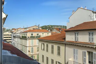a group of buildings in a city with roofs at Studio V - à 2 min du Palais - Hypercentre - Calme in Cannes