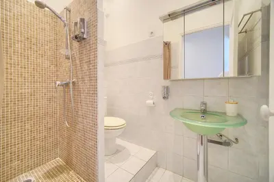 a bathroom with a green sink and a toilet at Chic 2 Pieces BALCON, HOCHE-HYPERCENTRE A1B162 in Cannes