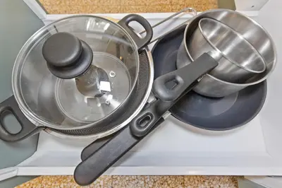 a group of utensils sitting on top of a kitchenvisor at Le Farniente - Peaceful - Parking - AC - Balcony in Le Cannet