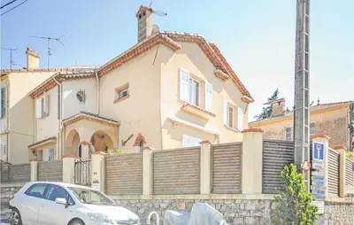a white car parked in front of a house at 2 Bedroom Awesome Apartment In Cannes in Cannes