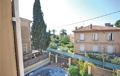 a view from a balcony of a building with a tub at 2 Bedroom Awesome Apartment In Cannes in Cannes