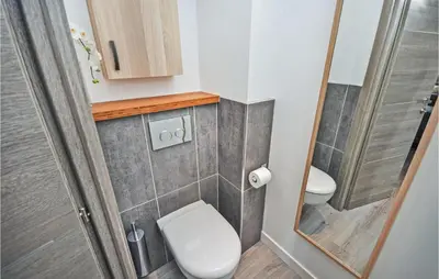 a small bathroom with a toilet and a shower at 2 Bedroom Awesome Apartment In Cannes in Cannes