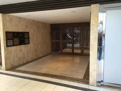 an empty entrance to a building with glass doors at Gray d' Albion Apartment in Cannes