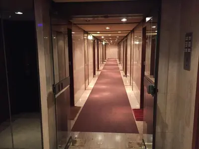a hallway of elevators in a building with a long corridor at Gray d' Albion Apartment in Cannes