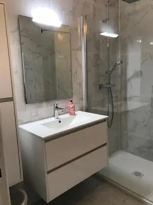 a bathroom with a sink and a shower at Gray d' Albion Apartment in Cannes