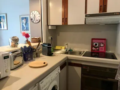 a kitchen with a sink and a counter top at Gray d' Albion Apartment in Cannes