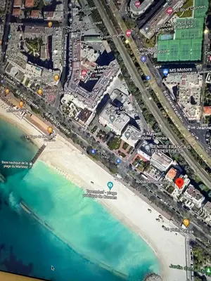 a map of a beach and the ocean at Appartement Rottaro luxueux 2 ch 2 sdb face à la mer in Cannes