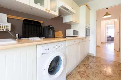 a kitchen with a washer and dryer on a counter at Apartment Seaside in Cannes