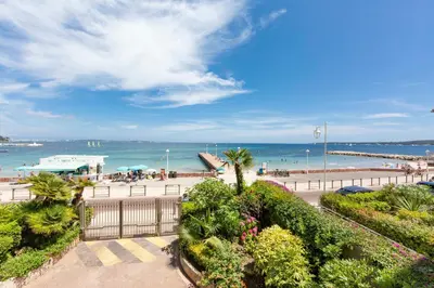 a view of a beach with the ocean in the background at Apartment Seaside in Cannes