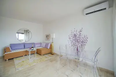 a living room with a glass table and a couch at Calme et Lumineux 2 chambres BALCON Vue MER-FORVILLE A2B262 in Cannes