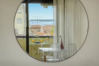 a mirror reflecting a room with a table and a window at Calme et Lumineux 2 chambres BALCON Vue MER-FORVILLE A2B262 in Cannes