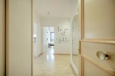 a hallway with a mirror and a white room at Calme et Lumineux 2 chambres BALCON Vue MER-FORVILLE A2B262 in Cannes