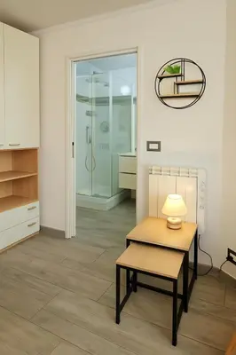 a room with a table and a glass shower at Étoile Riviera - Studio 2P, Centre, Plages & Palais in Cannes