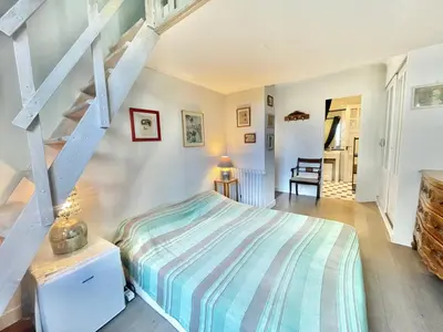 a bedroom with a bed and a staircase at La Marjolette by Welcome to Cannes in Cannes