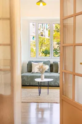 a living room with a couch and a table at Apartment near Croisette and Cannes festival in Le Cannet