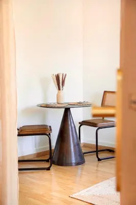 a table in a room with two chairs and a table at Apartment near Croisette and Cannes festival in Le Cannet