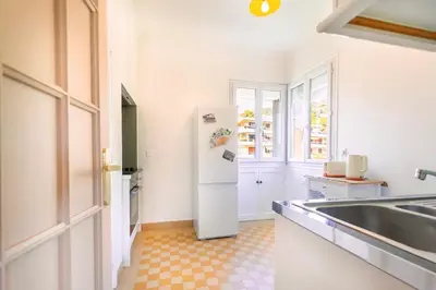 a kitchen with a refrigerator and a sink at Apartment near Croisette and Cannes festival in Le Cannet