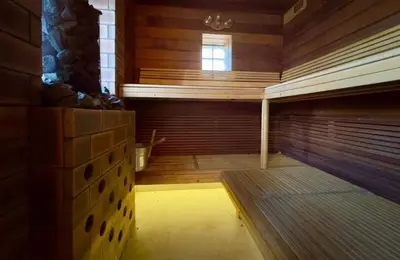 a room with a sauna with a bench in it at Eryvazur in Vallauris