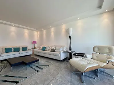 a living room with two couches and a table at Superbe 2 pièces - Première ligne Croisette in Cannes