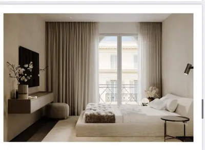 a bedroom with a bed and a large window at Croisette 066 in Cannes
