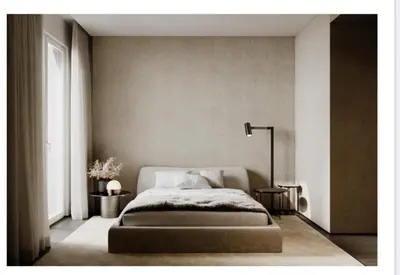 a bedroom with a bed and a lamp in it at Croisette 066 in Cannes